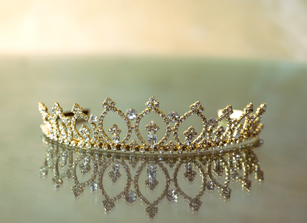 closeup-shot-elegant-crown-reflected-glass-surface-FREEPIK-CROP Queen Rania