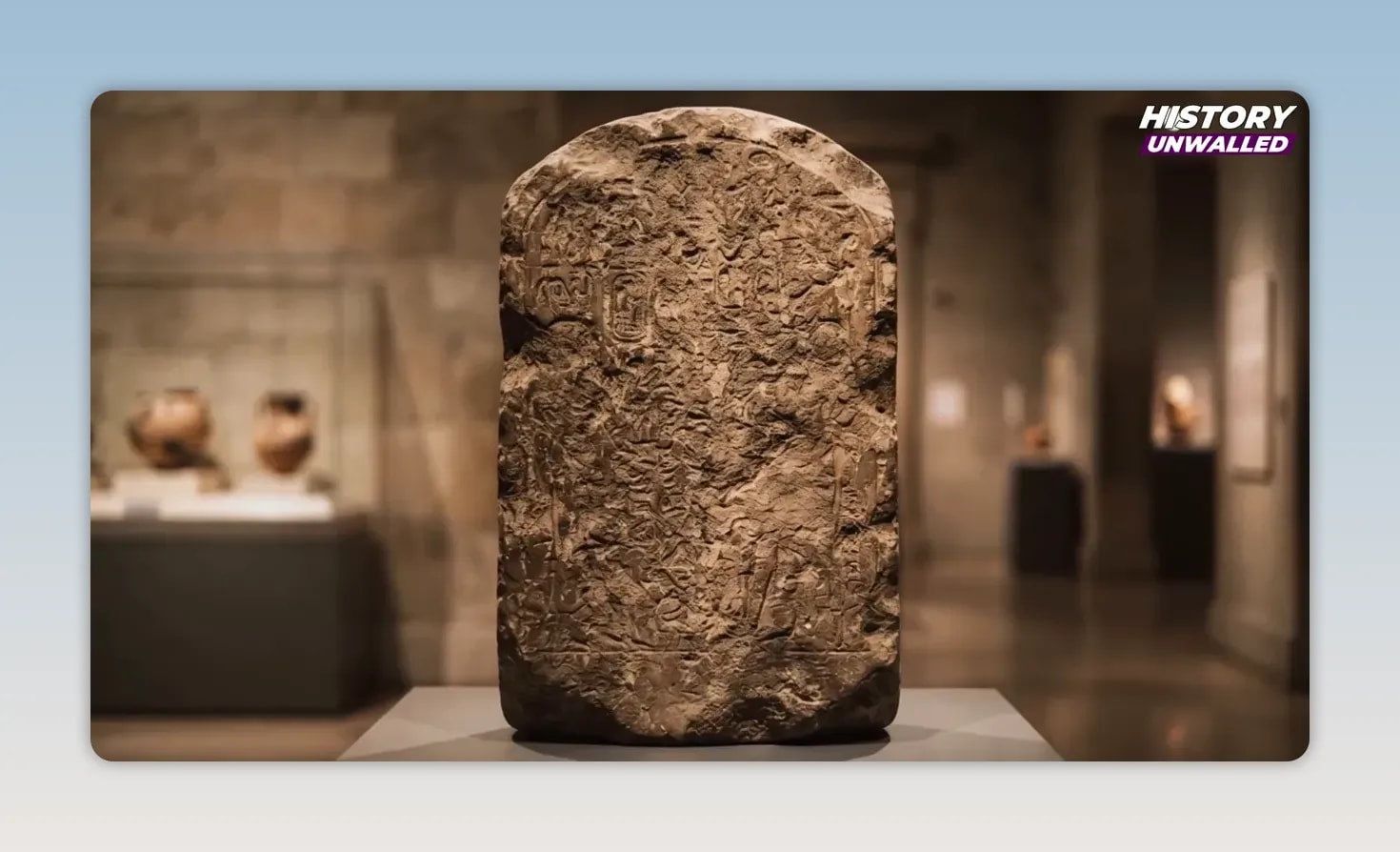 merneptah-stele-display Tall stone stele displayed upright in a museum gallery