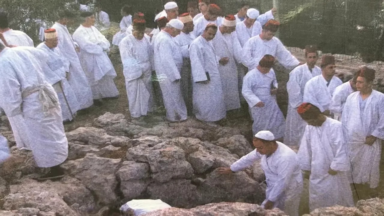 samaritan-passover-gathering Samaritan men dressed in white gathering outdoors for Passover